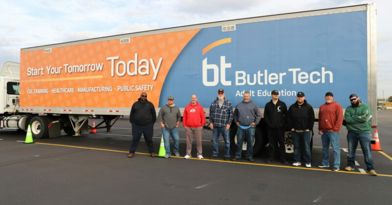 men standing in front of a Butler Tech CDL truck