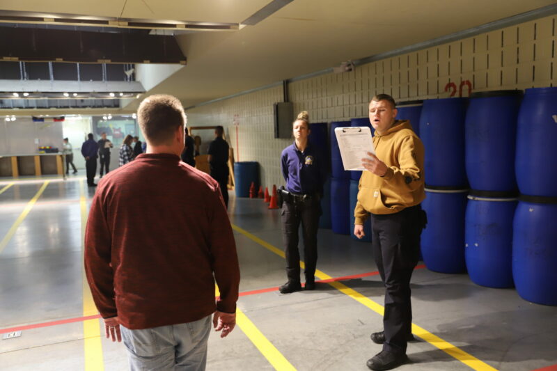 Basic Police Academy cadet administering sobriety testing in a simulation at Butler Tech