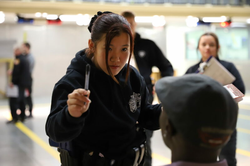 Basic Police Academy cadet administering sobriety testing in a simulation at Butler Tech