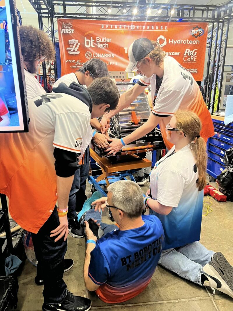 students working on a robot